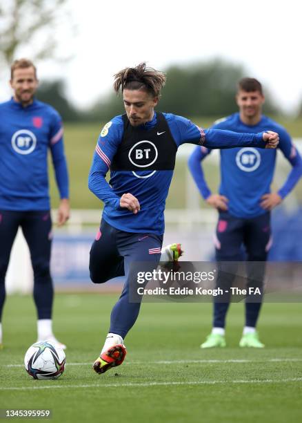 Jack Grealish shoots during a training session at St Georges Park on October 07, 2021 in Burton-upon-Trent, England.