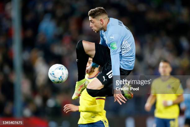 Federico Valverde of Uruguay kicks the ball in the air during a match between Uruguay and Colombia as part of South American Qualifiers for Qatar...