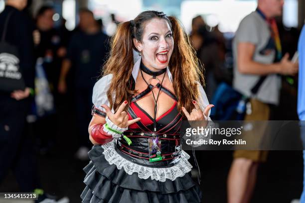 Cosplayer dressed as Harley Quinn from "Batman" and the DC Universe poses during the first day of Comic Con at Javits Center on October 07, 2021 in...