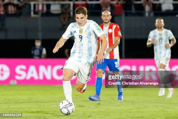 Julian Alvarez of Argentina drives the ball during a match between Paraguay and Argentina as part of South American Qualifiers for Qatar 2022 at...