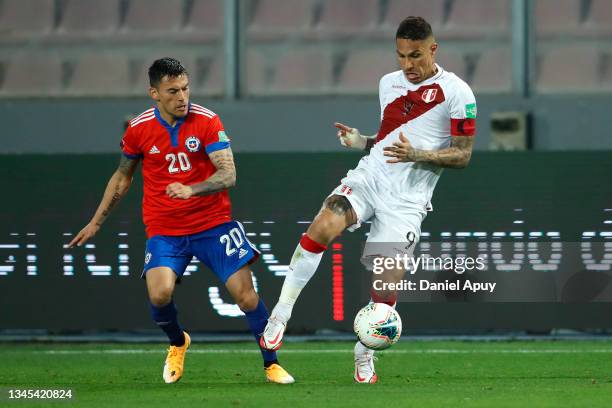 Paolo Guerrero of Peru fights for the ball with Charles Aránguiz of Chile during a match between Peru and Chile as part of South American Qualifiers...