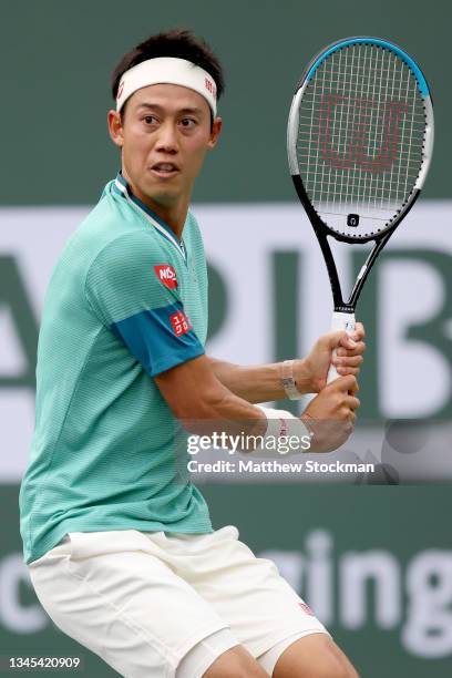 Kei Nishikori of Japan plays Joao Sousa of Portugal during the BNP Paribas Open at the Indian Wells Tennis Garden on October 07, 2021 in Indian...