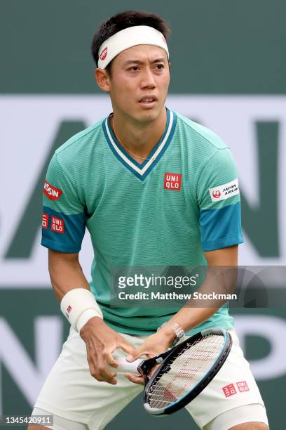 Kei Nishikori of Japan plays Joao Sousa of Portugal during the BNP Paribas Open at the Indian Wells Tennis Garden on October 07, 2021 in Indian...