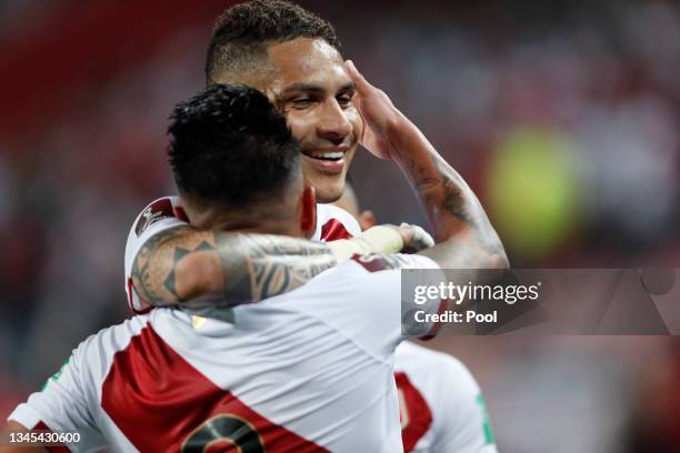 Christian Cueva of Peru celebrates with teammate Paolo Guerrero after scoring the first goal of his team during a match between Peru and Chile as...