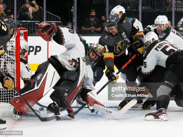 Karel Vejmelka of the Arizona Coyotes defends the net against Mark Stone of the Vegas Golden Knights in the second period of their preseason game at...