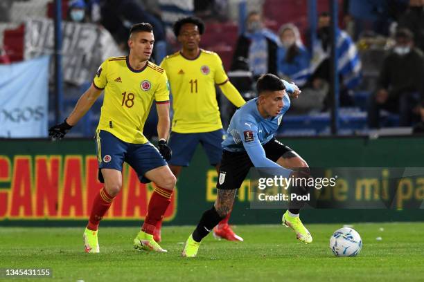 Brian Rodriguez of Uruguay controls the ball against Rafael Santos Borre of Colombia during a match between Uruguay and Colombia as part of South...