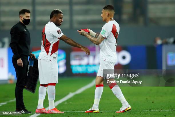 Paolo Guerrero of Peru gives teammate Jefferson Farfán the captain's band in a substitution during a match between Peru and Chile as part of South...