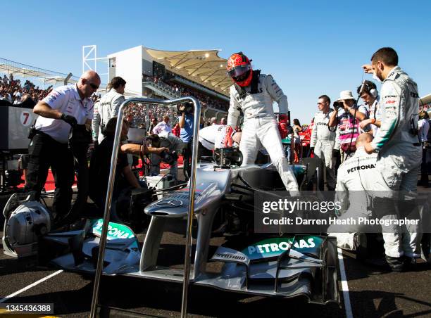 German Mercedes AMG Formula One team racing driver Michael Schumacher wearing his logo adorned fire protection suit overalls while stepping out of...