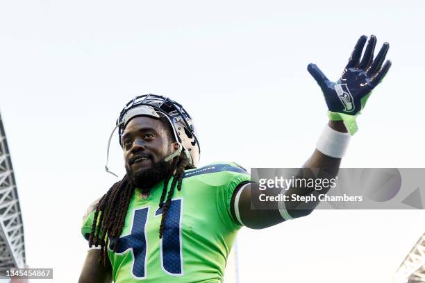 Alex Collins of the Seattle Seahawks waves before the game against the Los Angeles Rams at Lumen Field on October 07, 2021 in Seattle, Washington.