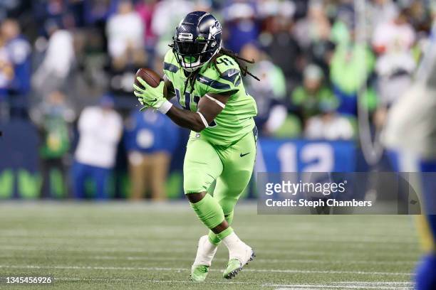 Alex Collins of the Seattle Seahawks carries the ball against the Los Angeles Rams during the fourth quarter at Lumen Field on October 07, 2021 in...
