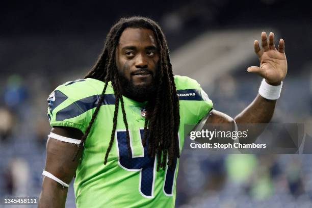 Alex Collins of the Seattle Seahawks jogs off the field after losing 26-17 to the Los Angeles Rams at Lumen Field on October 07, 2021 in Seattle,...