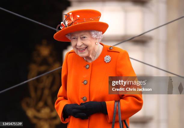 Queen Elizabeth II attends the launch of The Queen's Baton Relay for Birmingham 2022, the XXII Commonwealth Games at Buckingham Palace on October 07,...