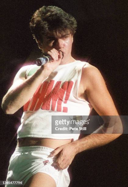 George Michael of English pop duo Wham performs on stage at Hammersmith Odeon on October 28th, 1983 in London, United Kingdom.
