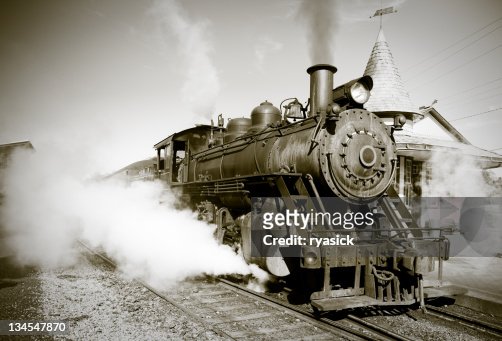 Sepia Toned Vintage Steam Engine Locomotive Train Leaving Station