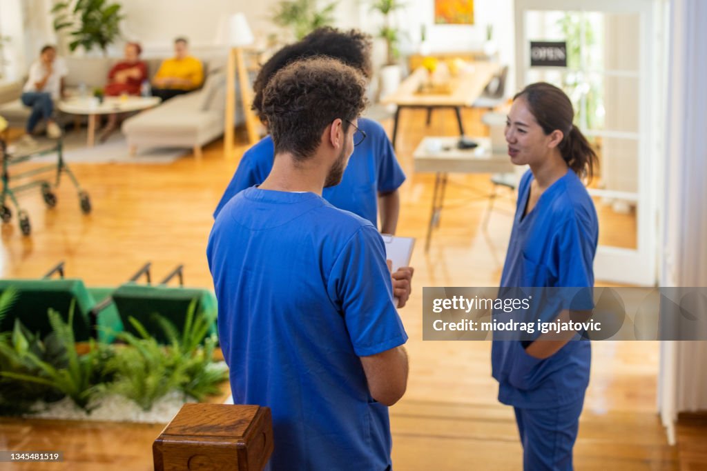 Nursing assistants having a meeting at nursing home