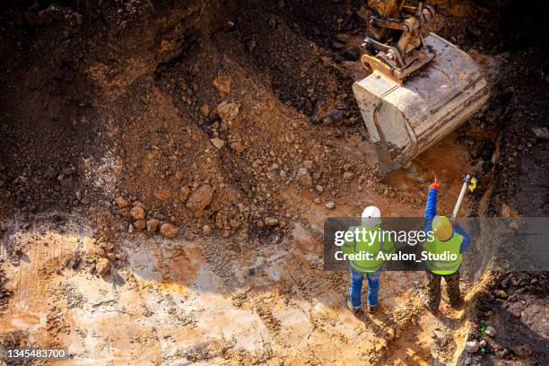 surveyors at the construction site - soil liquid levels stock pictures, royalty-free photos & images