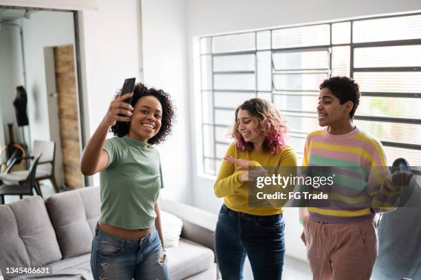 friends filming themselves dancing (or on a video call) at home - girls playing with themselves bildbanksfoton och bilder