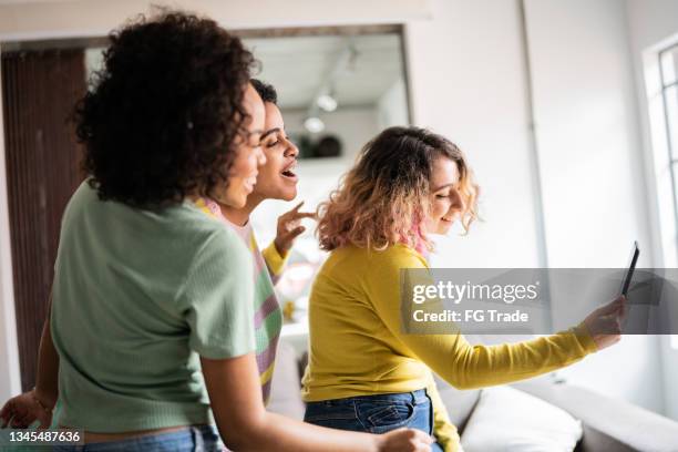 friends filming themselves dancing (or on a video call) at home - girls playing with themselves bildbanksfoton och bilder