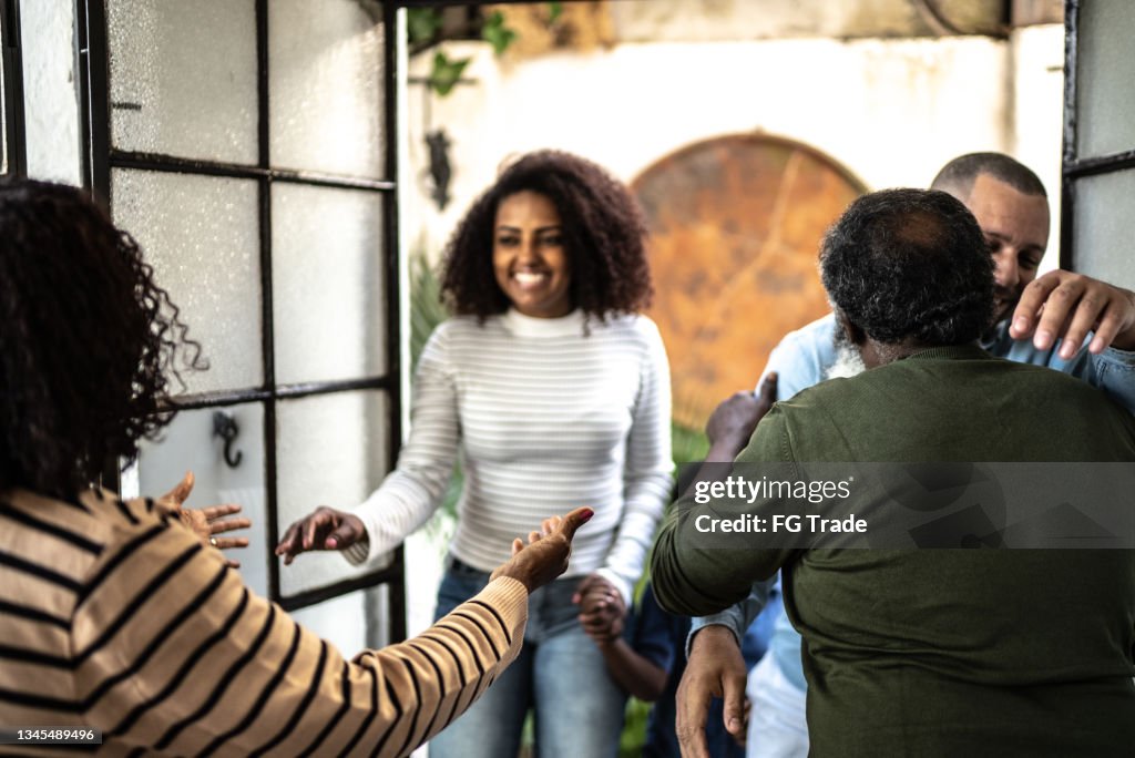 Family members greeting each other at home