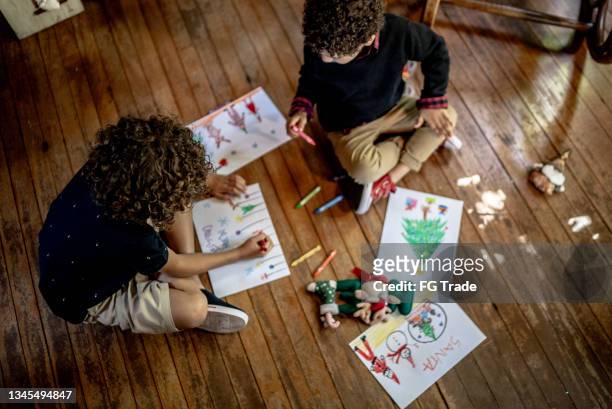 brothers drawing together at home - drawing activity stock pictures, royalty-free photos & images