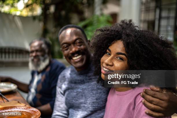 portrait of father and daughter at the lunch table at home - fathers day lunch stock pictures, royalty-free photos & images
