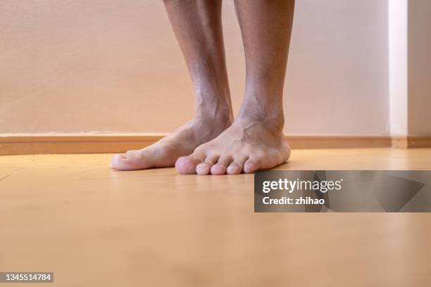 the man stood barefoot. - personalized medicine stock pictures, royalty-free photos & images