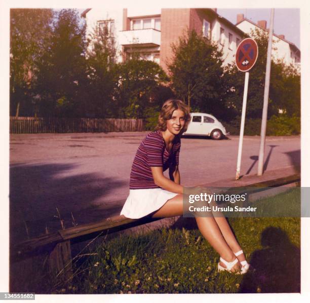 young woman in evening sun - archival car stock pictures, royalty-free photos & images