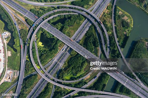 aerial view of expressway road intersection, traffic in shanghai ,china - kreuzung stock-fotos und bilder