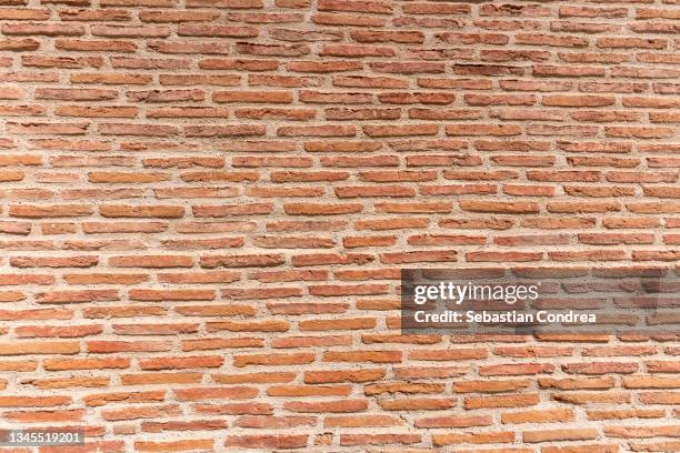 old and aged red brick wall texture background with vignetting. - facade painting stock pictures, royalty-free photos & images