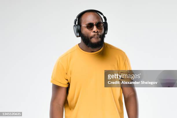 one african-american man at the studio. close up portrait. protest concept. guy on white background with copy space. - anti quarantine protest stock pictures, royalty-free photos & images