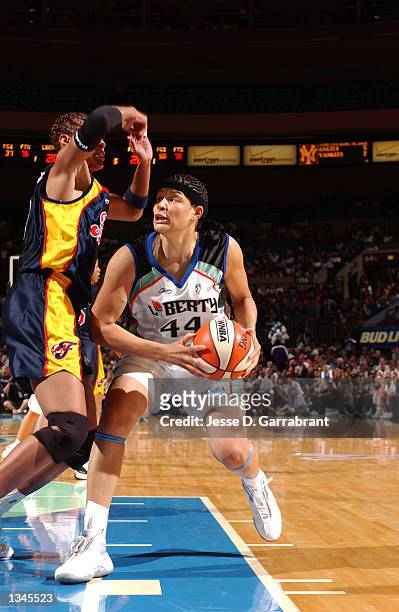 Tamika Whitmore of the New York Liberty drives against a defender from the Indiana Fever during game 3 of the opening round of the 2002 WNBA Playoffs...