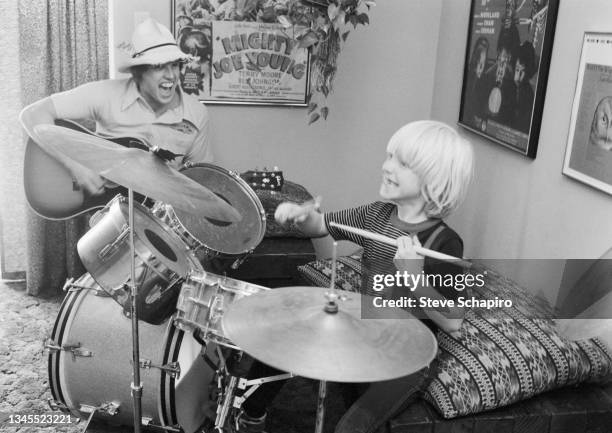 American actor Gary Busey plays guitar with his son , Jake Busey , who plays drums, Los Angeles, California, 1978.