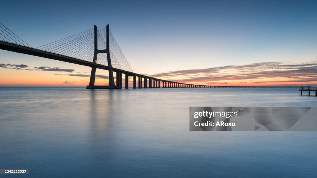The Vasco da Gama Bridge crosses the Tagus River, and is one of the longest bridges in the world. Lisbon is an amazing tourist destination because their urban landscapes, by its light, its monuments.