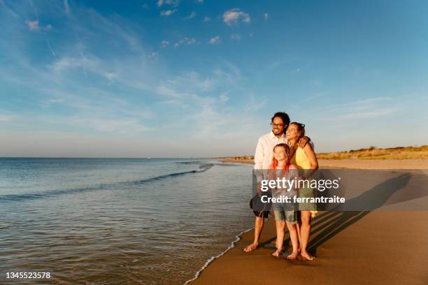 family enjoying the sunset by the sea - virginia beach va stock pictures, royalty-free photos & images