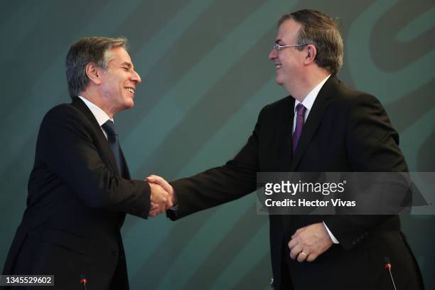 Secretary of State Antony Blinken and Mexican Foreign Minister Marcelo Ebrard greet during a conference as part of the High Level Security Dialogue...