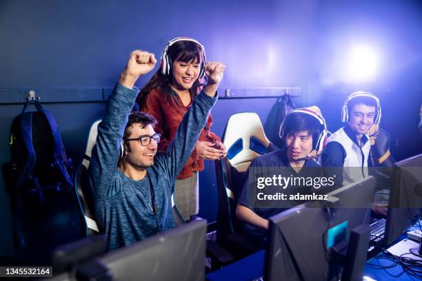 esports team with coach giving advice - esports stock pictures, royalty-free photos & images
