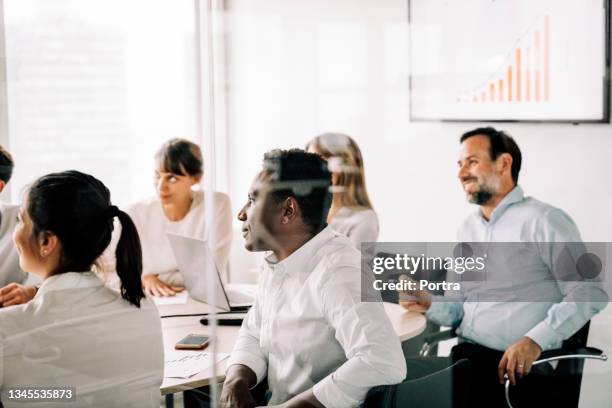 business people inside office meeting room - directievergadering stockfoto's en -beelden