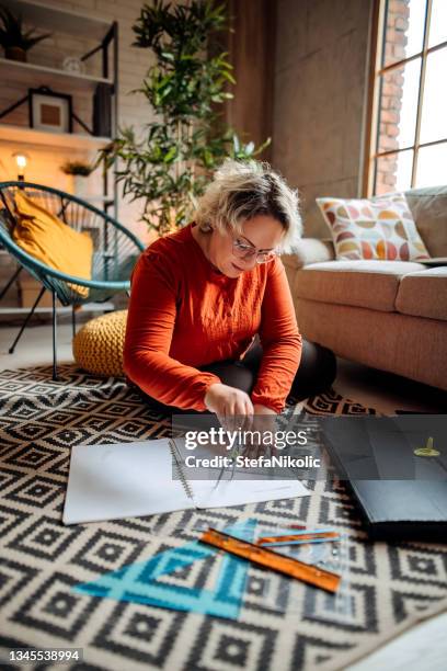 art therapy woman drawing sitting floor - art therapy stock pictures, royalty-free photos & images