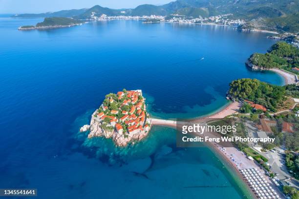sveti stefan island with pink sand beach, budva, montenegro - kotor stock-fotos und bilder