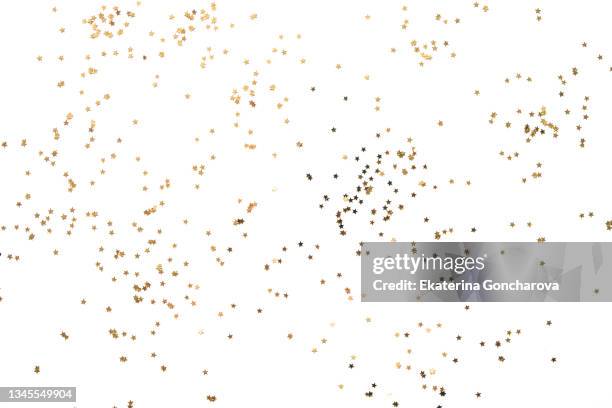 gold sparkling stars on a white isolated background. - etoile dorée photos et images de collection