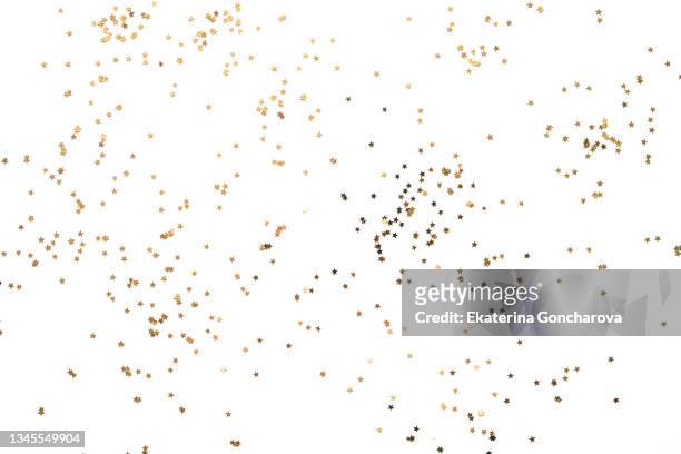 gold sparkling stars on a white isolated background. - confetti stock pictures, royalty-free photos & images