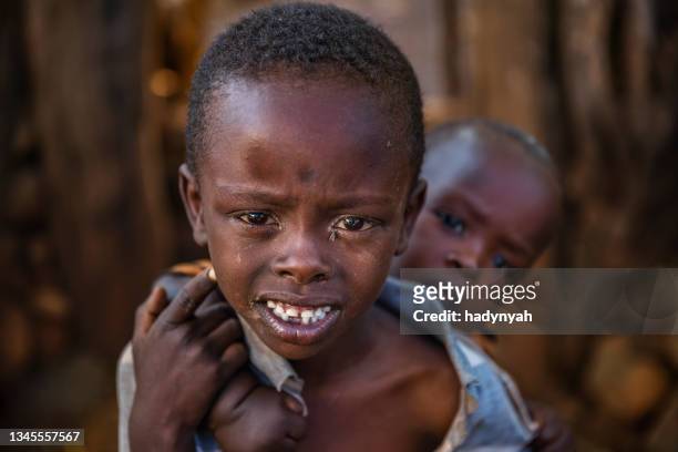 african boy carrying his younger brother, ethiopia, africa - ethiopia photos 個照片及圖片檔