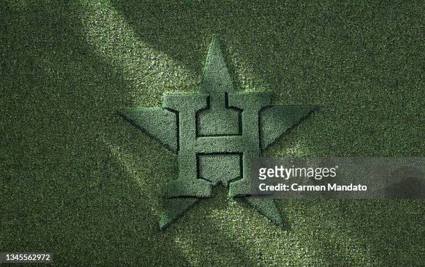 Detail as sun falls across ivy on a Houston Astros logo during Game 2 of the American League Division Series between the Chicago White Sox and the...