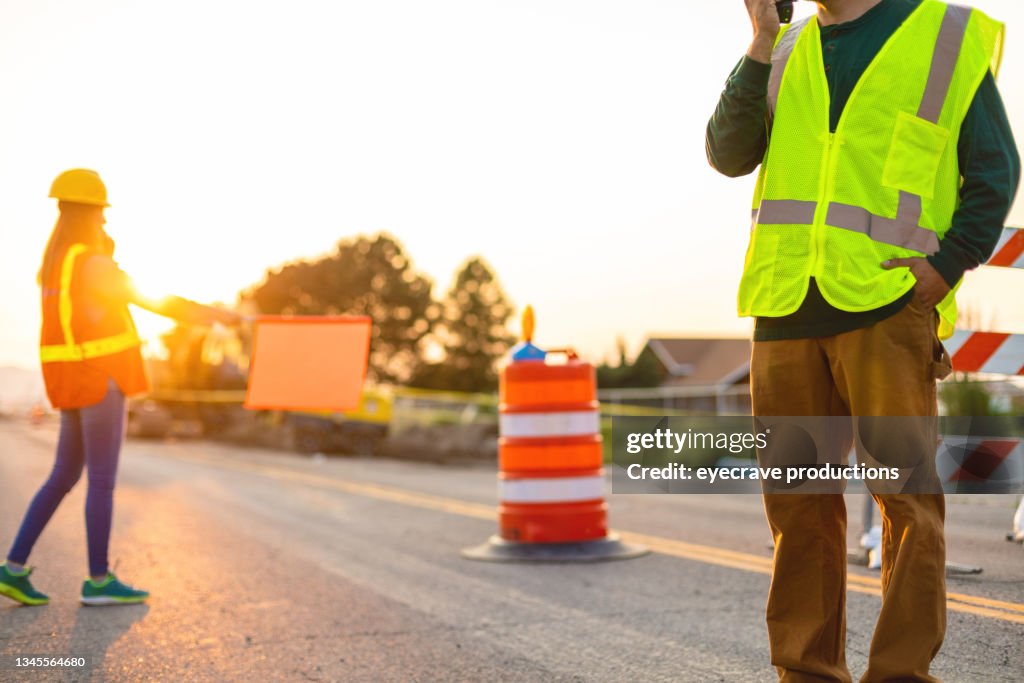 Communication Portrait Hispanic Workers Setting Barriers and Directing Traffic Street Road and Highway Construction Photo Series