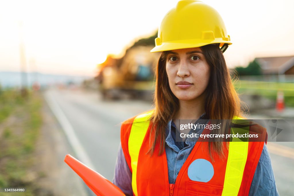 Concerned Portrait of Hispanic Workers Setting Barriers and Directing Traffic Street Road and Highway Construction Photo Series