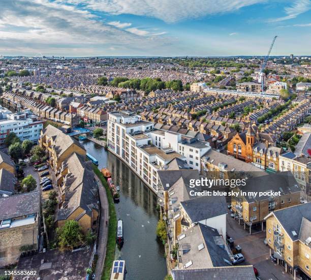the terrace houses adjacent to the harrow road at maida hill and the grand union canal,  paddington arm - grand union canal stock pictures, royalty-free photos & images