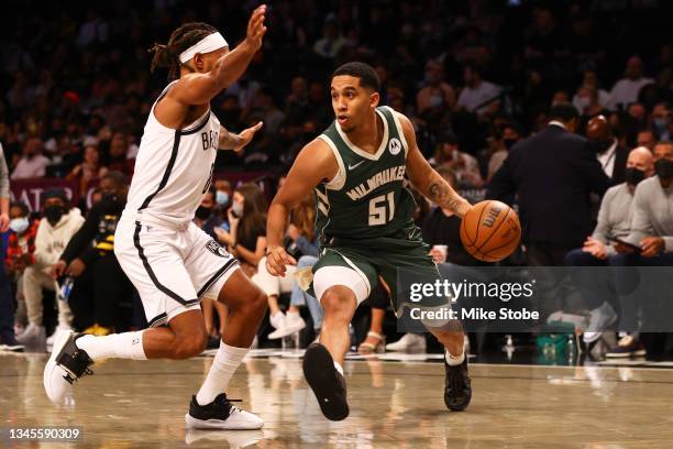 Tremont Waters of the Milwaukee Bucks drives to the net against the Brooklyn Nets at Barclays Center on October 08, 2021 in New York City. NOTE TO...