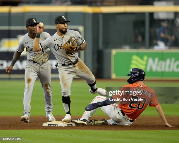 Leury Garcia of the Chicago White Sox turns a double play in the sixth inning against the Houston Astros during Game Two of the American League...