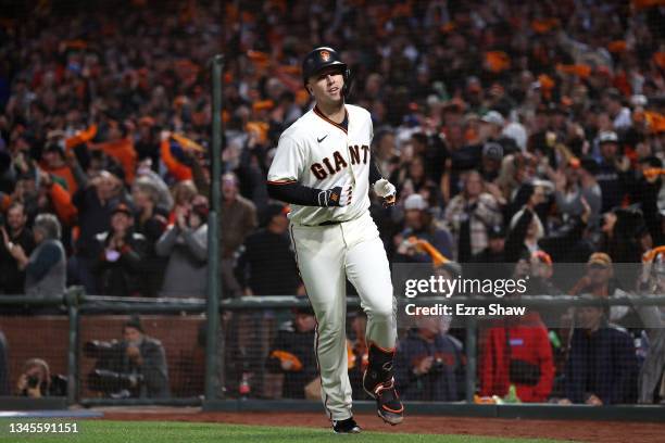 Buster Posey of the San Francisco Giants celebrates after hitting a two-run home run off Walker Buehler of the Los Angeles Dodgers during the first...