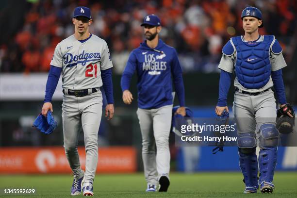Walker Buehler, pitching coach Mark Prior, and Will Smith walk to the dugout prior to Game 1 of the National League Division Series against the San...